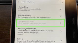 A Kindle Oasis with "Update your Kindle" grayed out.