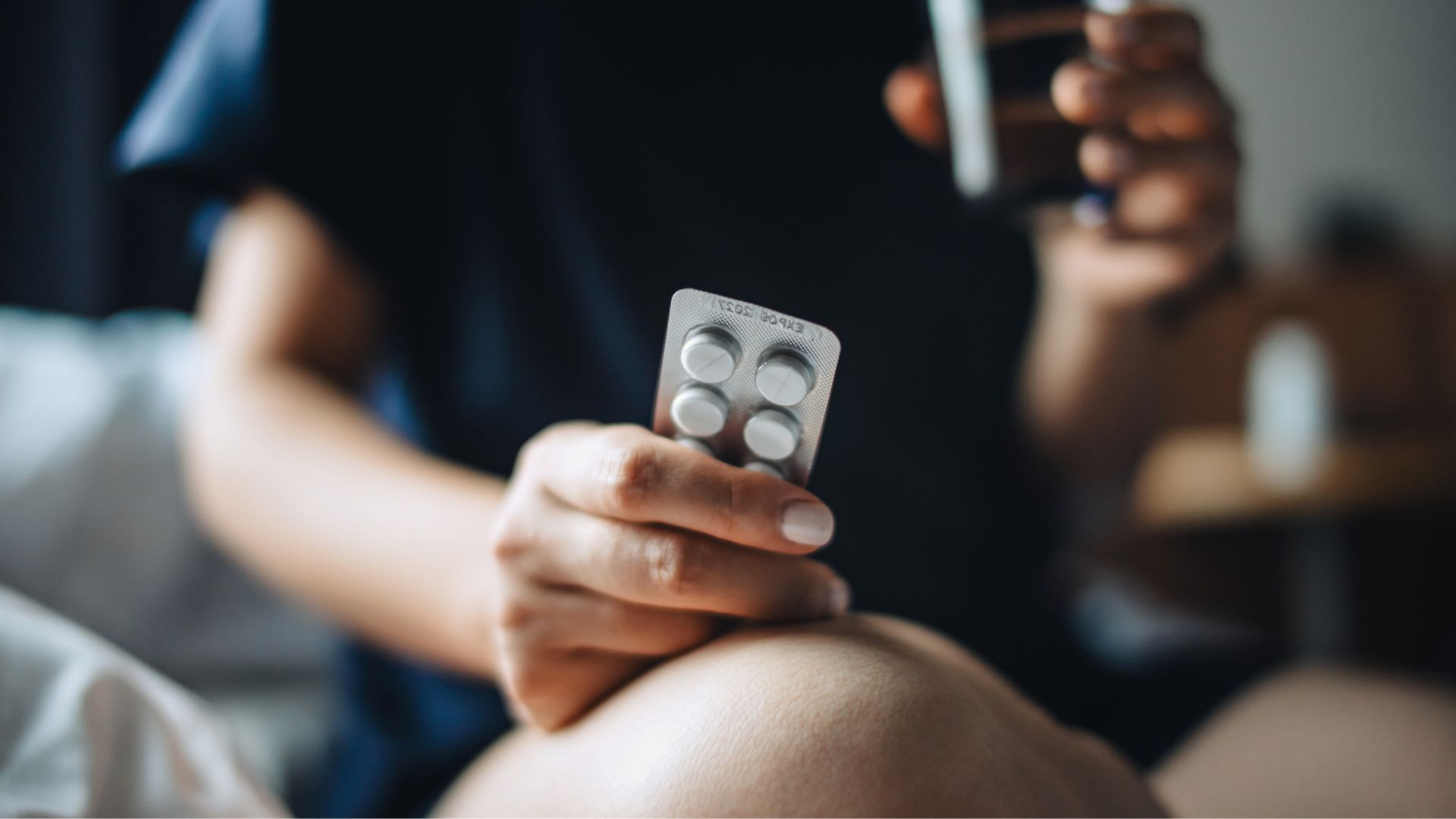 Woman holding Veoza packet of tablets
