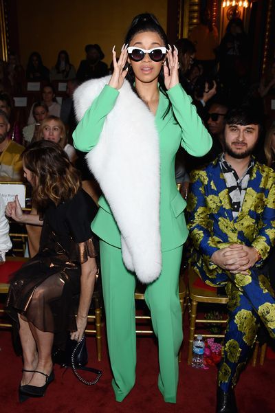 Fashion, Fashion design, Fur, Eyewear, Outerwear, Event, Textile, Costume, Red carpet, Flooring,