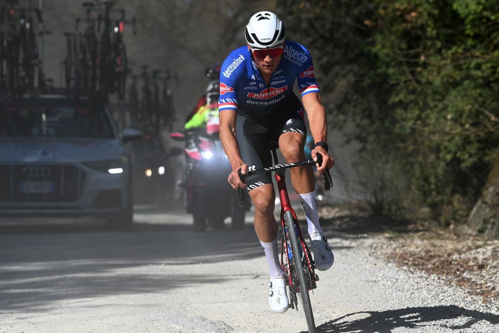 Mathieu van der Poel (Alpecin-Deceunick) chases back on to the peloton after a mechanical