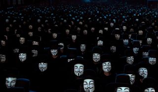 V For Vendetta a crowd wearing V masks at night