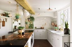 A white classic kitchen from deVOL with marble and wooden worktops