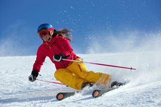 Woman downhill skiing