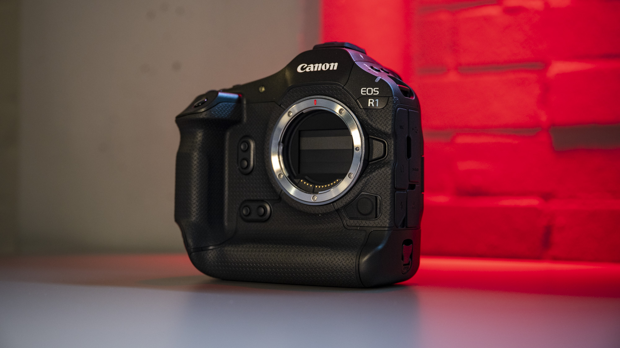 Canon EOS R1 mirrorless camera with red brick background