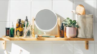bathroom shelf with mirror and cosmetics