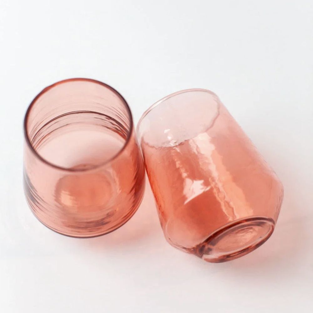 Two pink glass tumblers