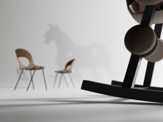 Chairs and shadow of rocking horse