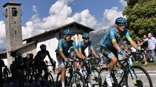 Astana Pro Team Denmark rider Jakob Fuglsang (R) leads the pack as they past the Shrine of Madonna del Ghisallo 