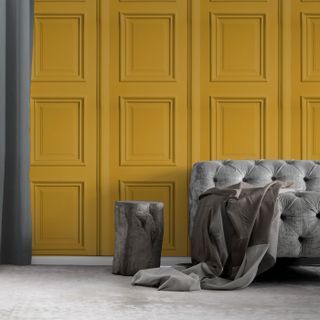 mustard yellow wallpaper with panelling design in living room