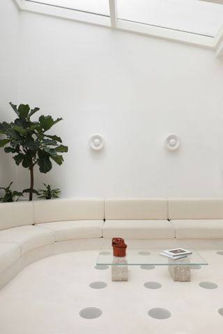 A long inbuilt white couch