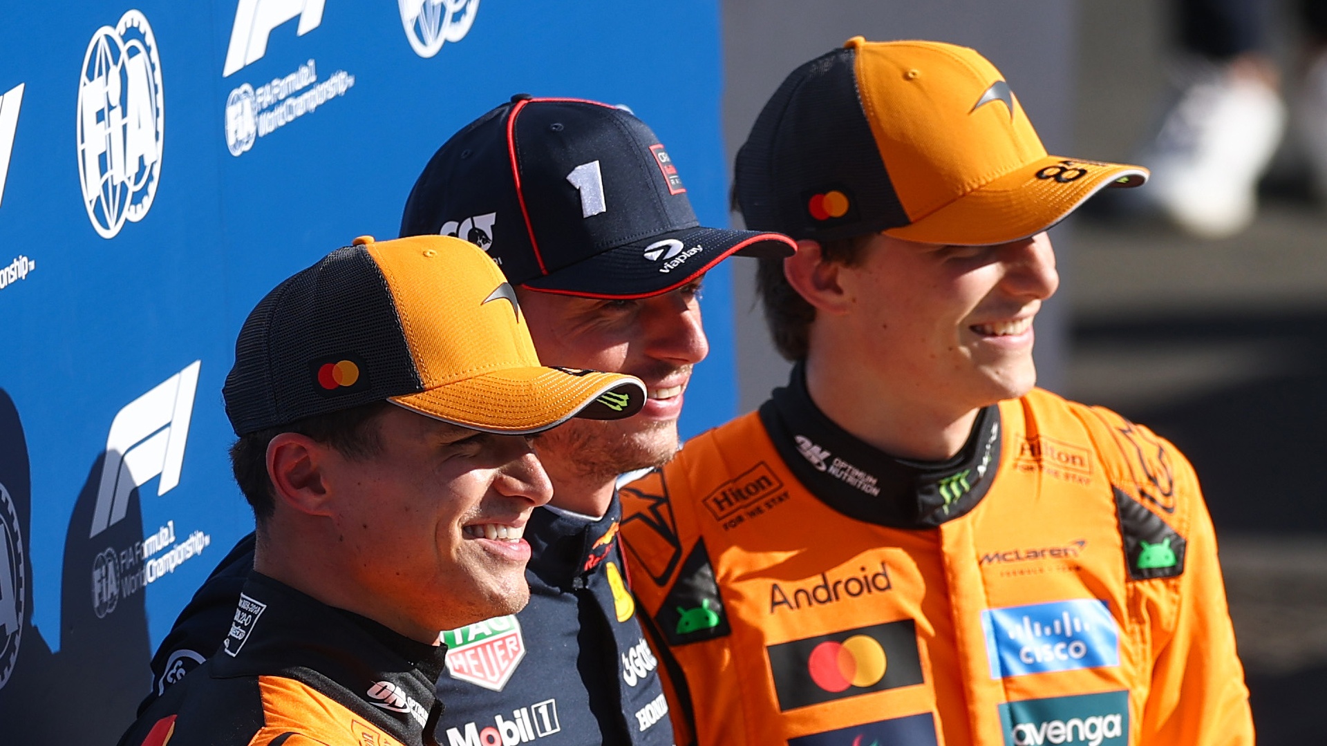 Lando Norris, Max Verstappen and Oscar Piastri posing for a picture together