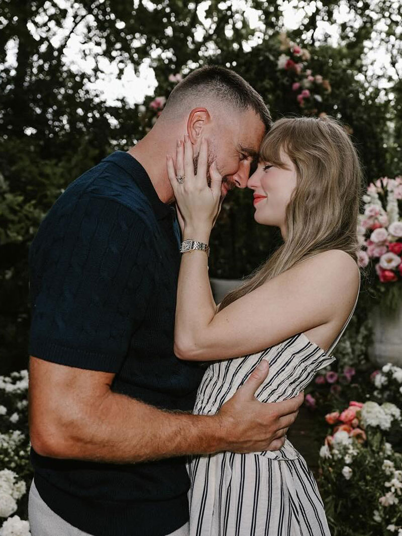 Taylor Swift wearing a gold watch in her engagement announcement.