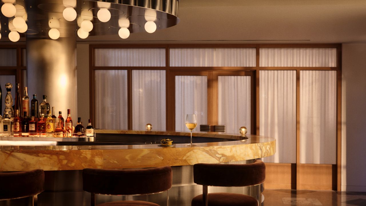 A multidisciplinary space for retail, hospitality, and culture features 1970s-inspired furnishings, sleek and textural details, an earthy palette, wood, stone, or ceramic surfaces, and a lush outdoor.