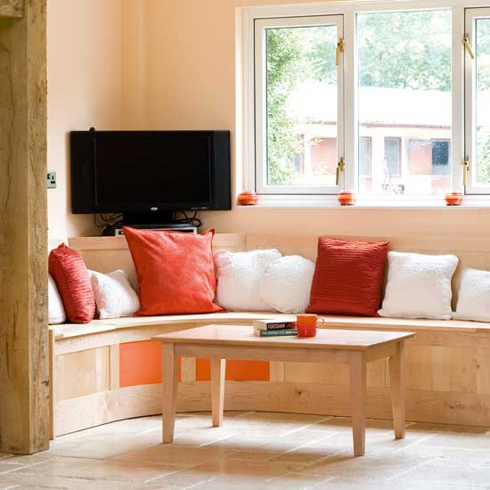 seating areal with pillows and tv