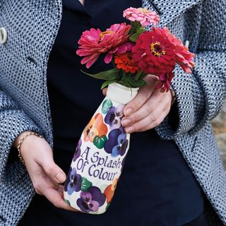 lady holding personalised vase with flower