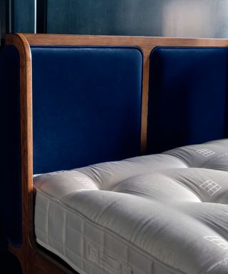 Soho House x Hypnos Exclusive Mattress on a blue bed frame.