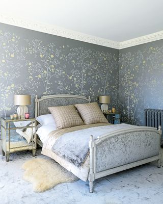 bedroom with double bed and grey patterned wallpaper