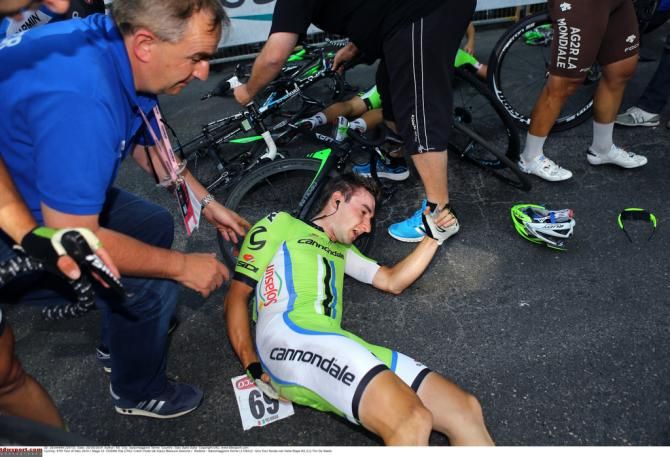 A very sore Elia Viviani (Cannondale) tries to get back on his feet