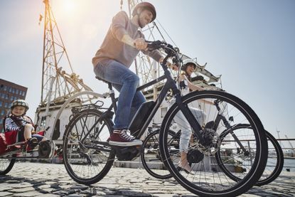 A family on e-bikes