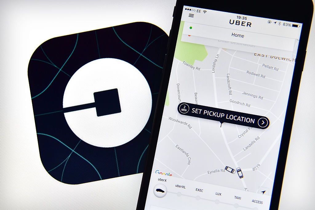 Uber logo and smartphone.