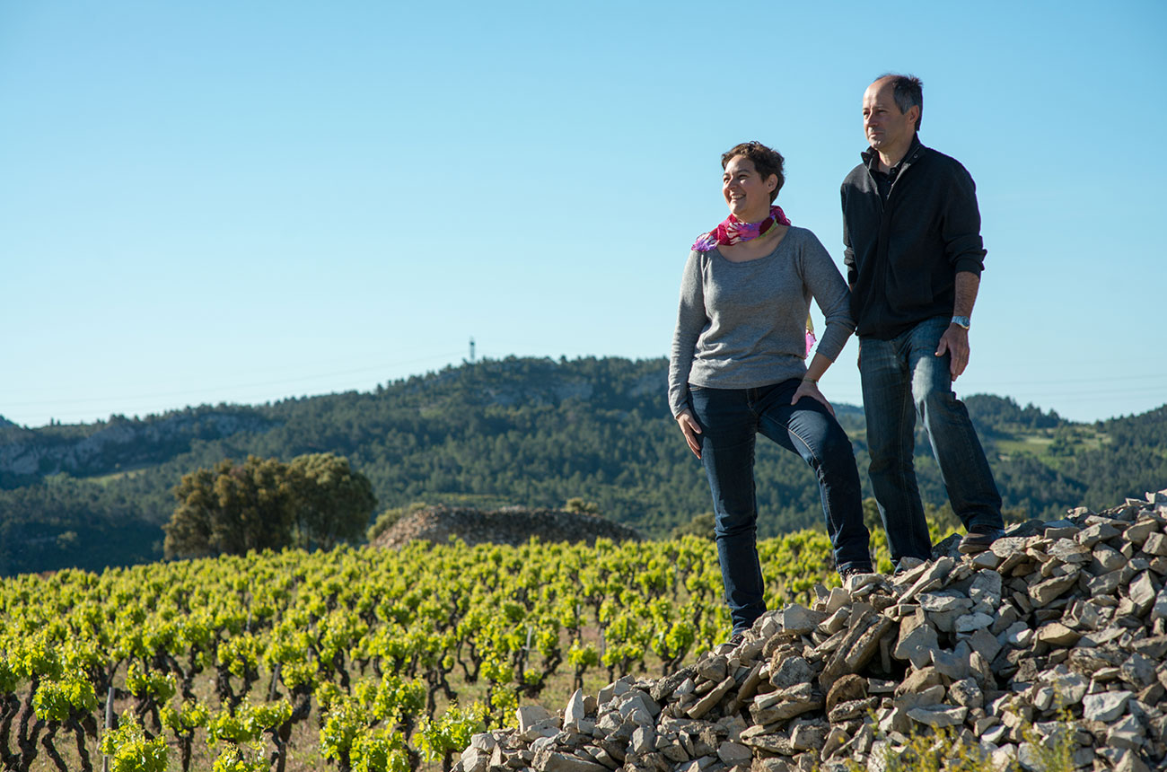 Anne Gros and Jean-Paul Tollot in front of a vineyard