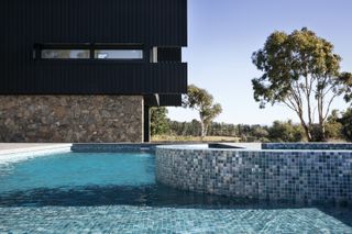 above ground pool with mosaic tiles on the wall and floor
