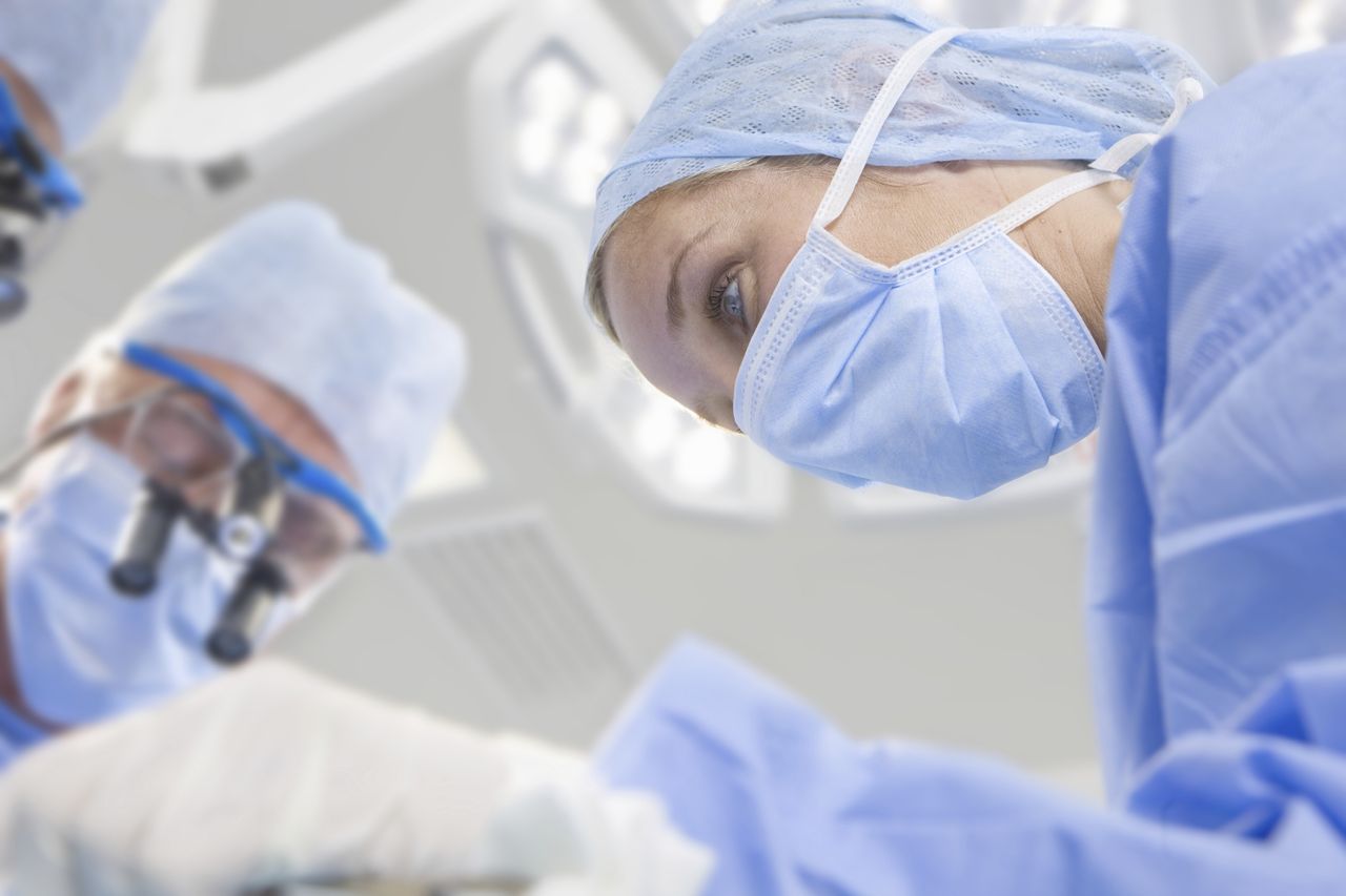 Surgeons performing in an operating room