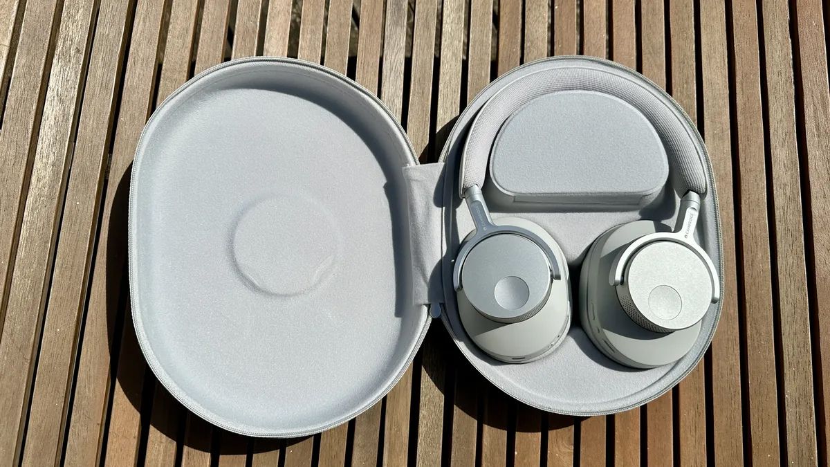 Cambridge Audio Melomania P100 headphones on a wooden surface
