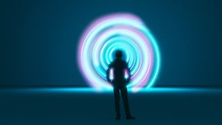 a man stands in front of a spinning vortex of light