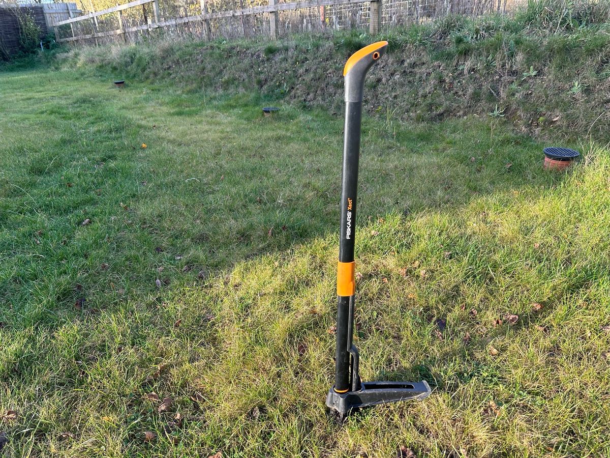 The Fiskars weed puller tool in my garden