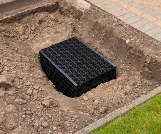 A small soakaway or dry well in a back yard