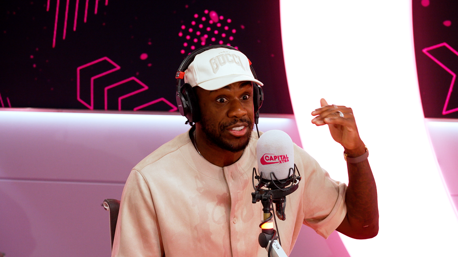 Michail Antonio speaking into a mic on the Capital XTRA breakfast show.