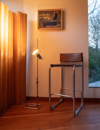 High bar stool and lamp in interior space