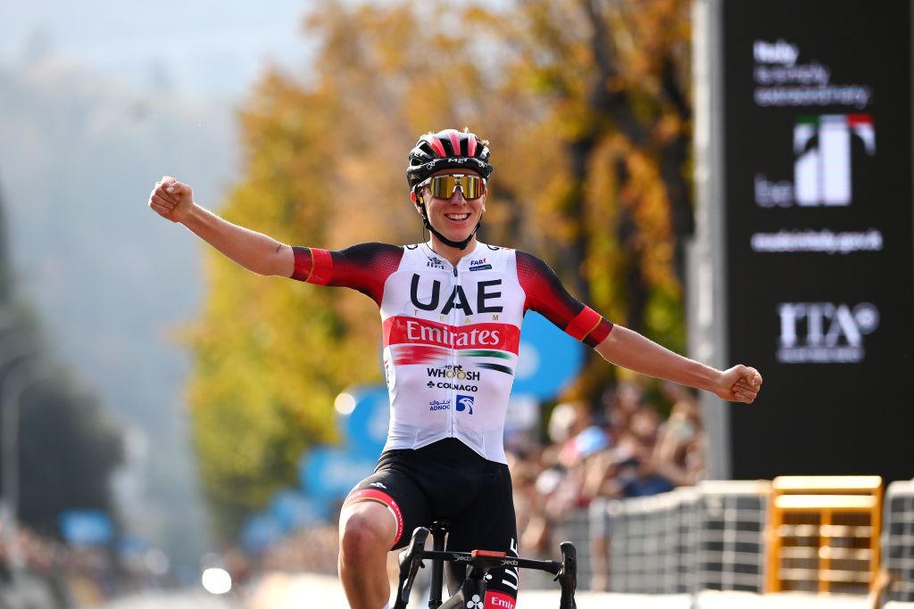 Tadej Pogacar crossing the line as he wins Il Lombardia 2022