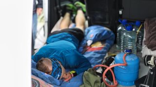 Damian Hall sleeps in a van during his record-breaking run