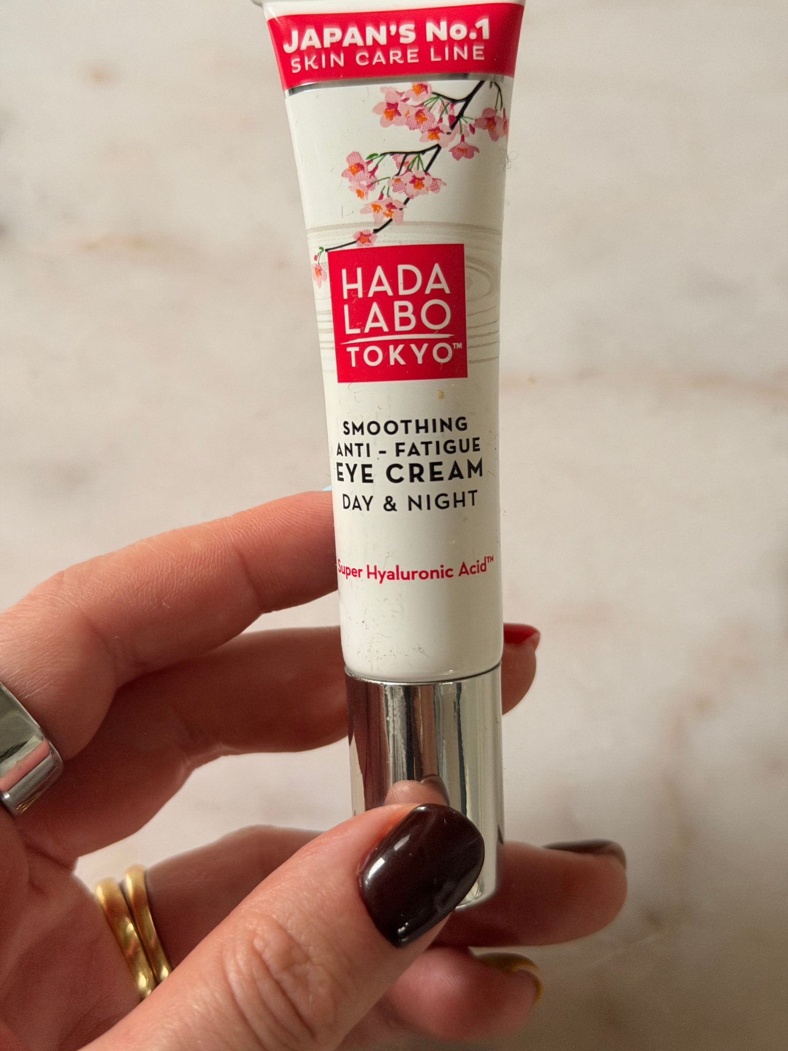 Freelance beauty editor Grace Day holding the Hada Labo eye cream