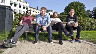 Mastodon posing for a photograph on a park bench in 2011