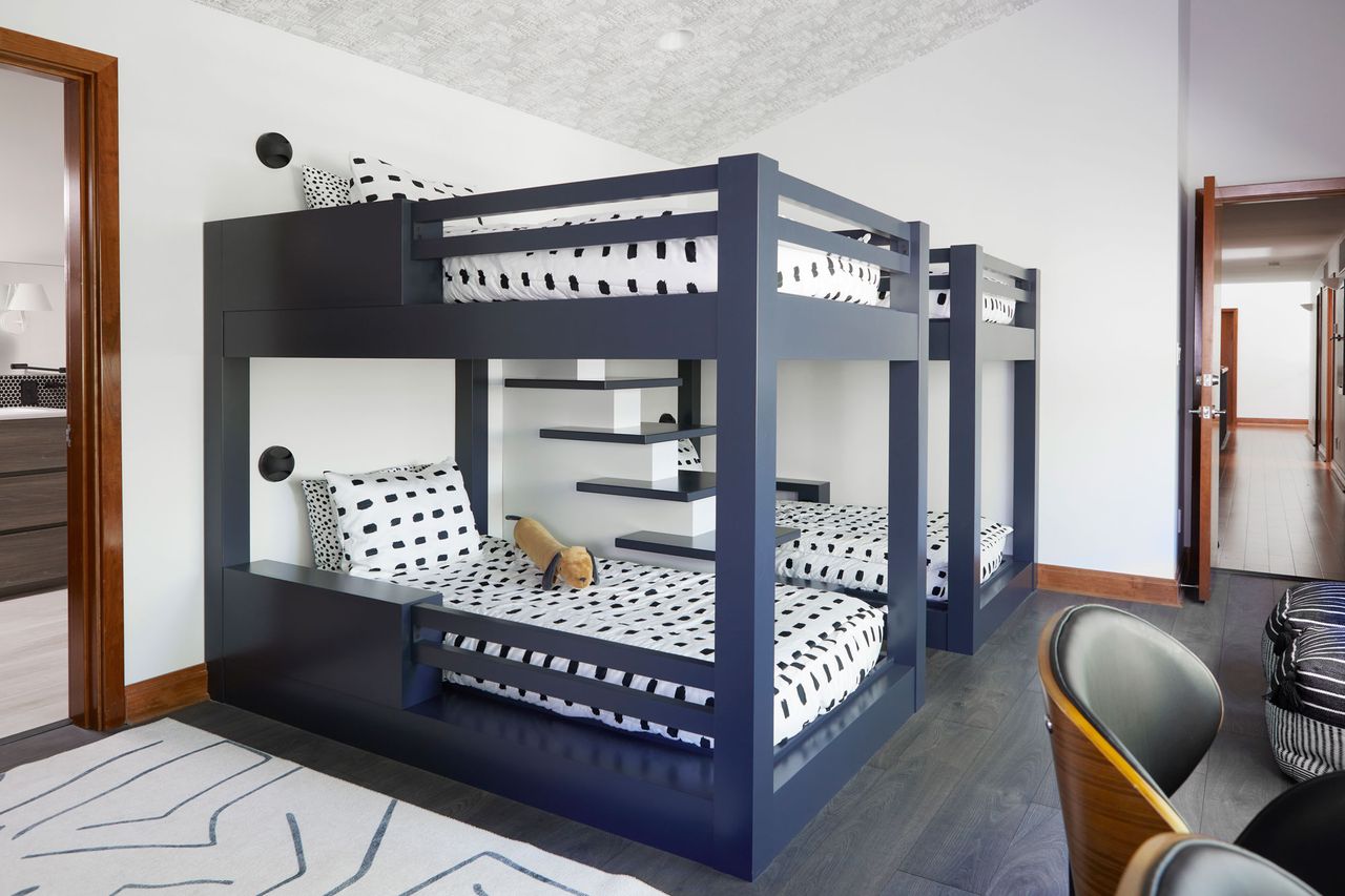 a black and white kids sharing room with two bunk beds