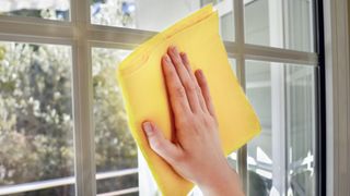 Cleaning window pane with cloth