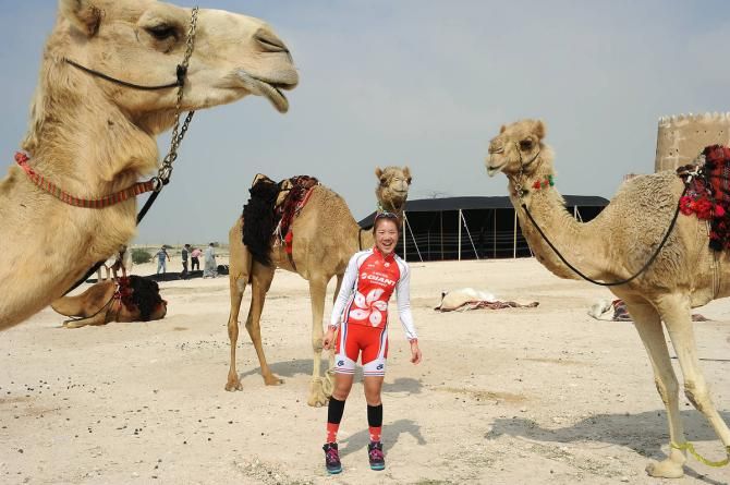 Riders posed with camels before stage 2