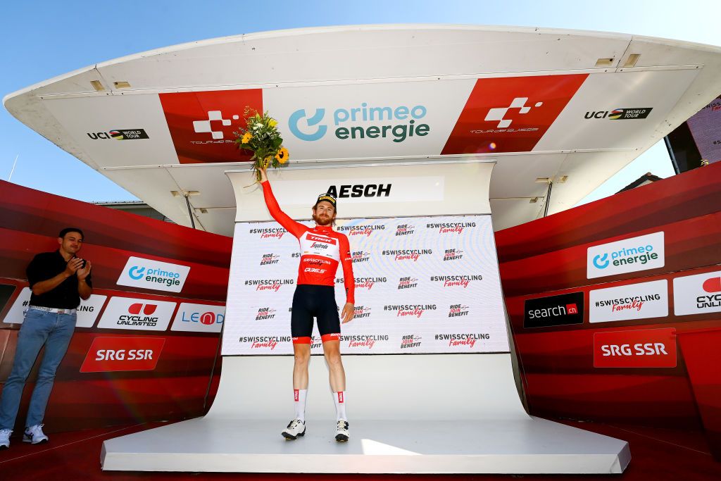 AESCH SWITZERLAND JUNE 13 Quinn Simmons of United States and Team Trek Segafredo celebrates winning the red mountain jersey on the podium ceremony after the 85th Tour de Suisse 2022 Stage 2 a 198km stage from Kusnacht to Aesch ourdesuisse2022 WorldTour on June 13 2022 in Aesch Switzerland Photo by Tim de WaeleGetty Images