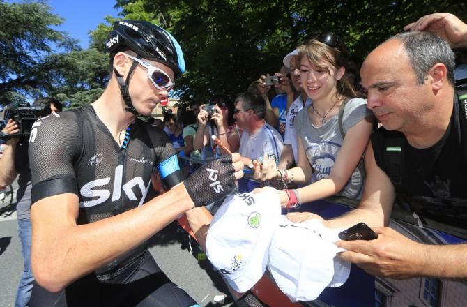 Chris Froome (Sky) signs autographs prior to the start of stage 8