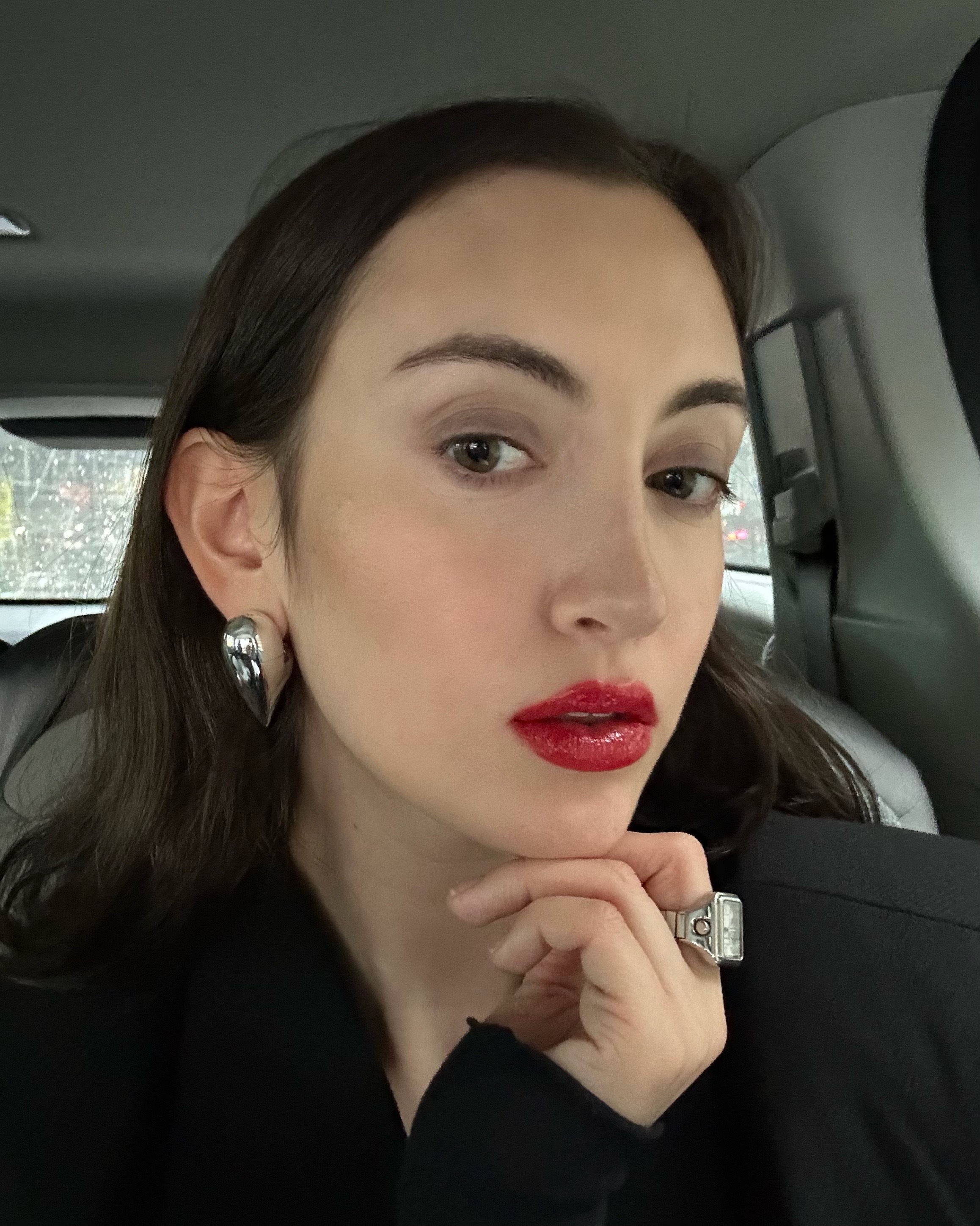 WWW associate beauty editor Alyssa Brascia wearing the Valentino Spike Valentino Buttery Matte Lipstick in Red Fiesta with Valentino's Puffer Complex Lip Plumper Gloss on top.