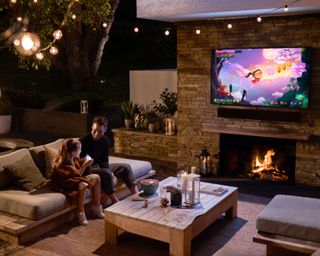 Samsung The Terrace mounted to wall outside above fireplace