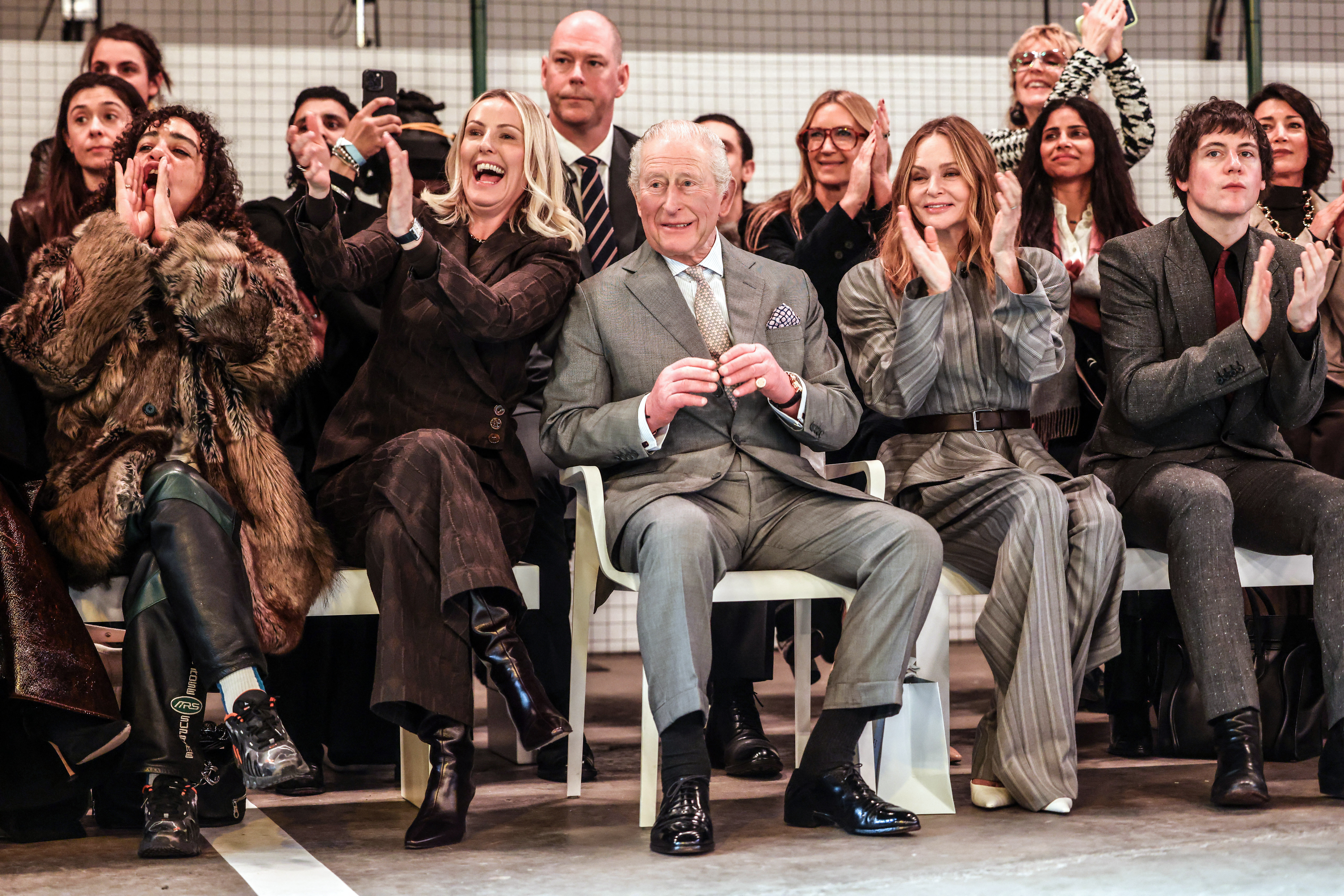 King Charles clapping in the front row at London Fashion Week