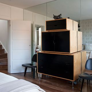 room with white door and black storage