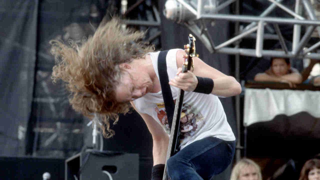 Metallica’s Jason Newsted performing onstage in 1988