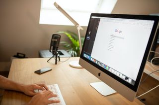 A person using one of the best web browsers on a laptop.