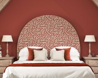 The Headboard Workshop statement headboard in patterned fabric with red walls