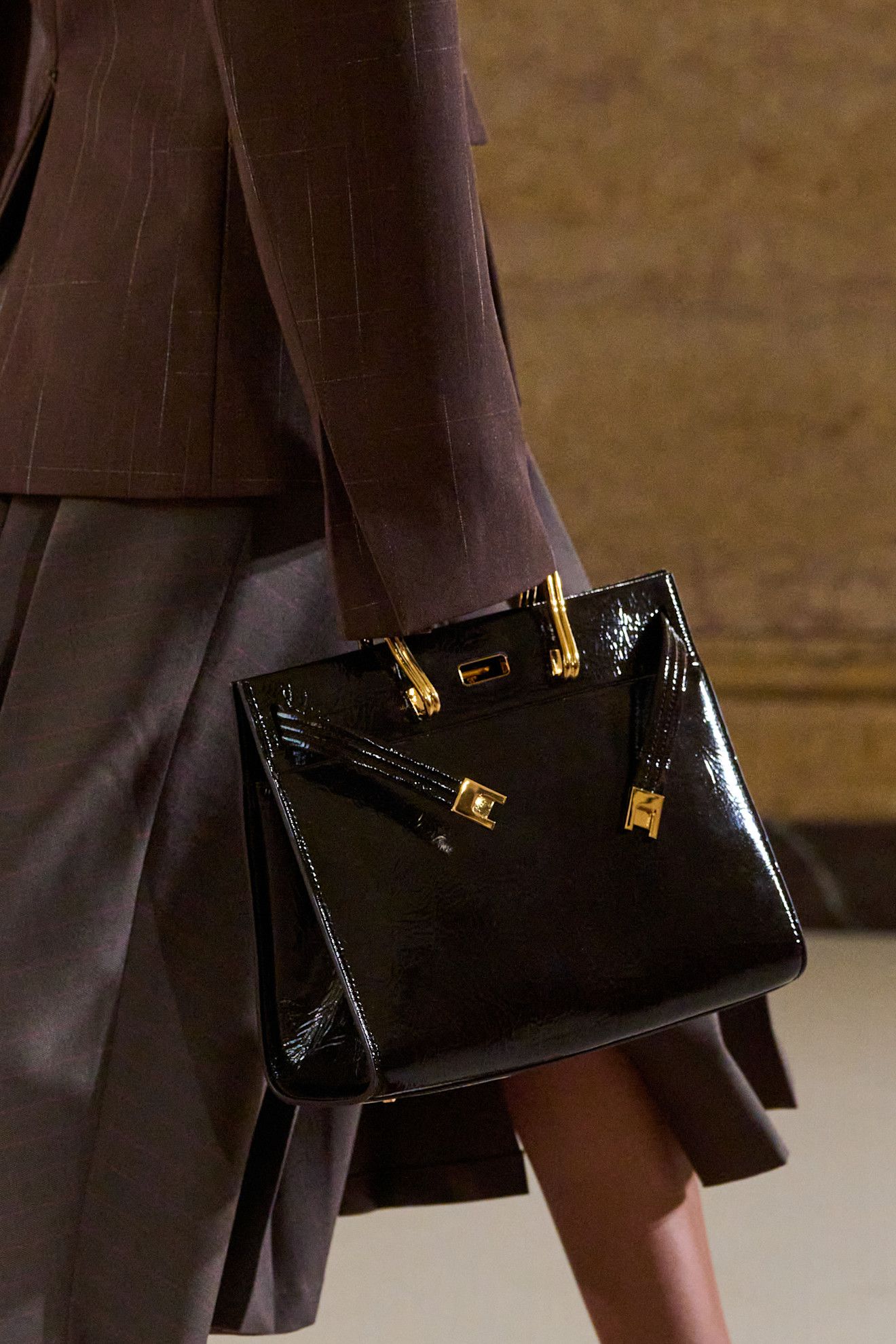 A model wearing the Tory Burch 'Lee Radziwill' bag on the runway.